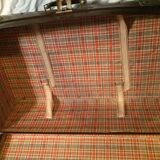 Suitcase vintage leather inside and brown carpeted home