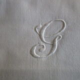 Old pillow taie in monogrammed cotton