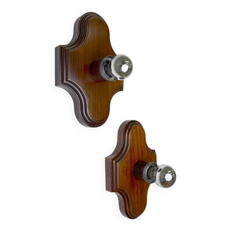 Pair of geometric Art Deco wall lights, carved brown wood, France, 1960s