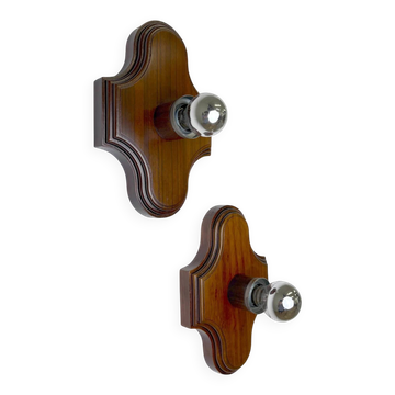 Pair of geometric Art Deco wall lights, carved brown wood, France, 1960s