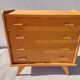 commode vintage aux pieds compas