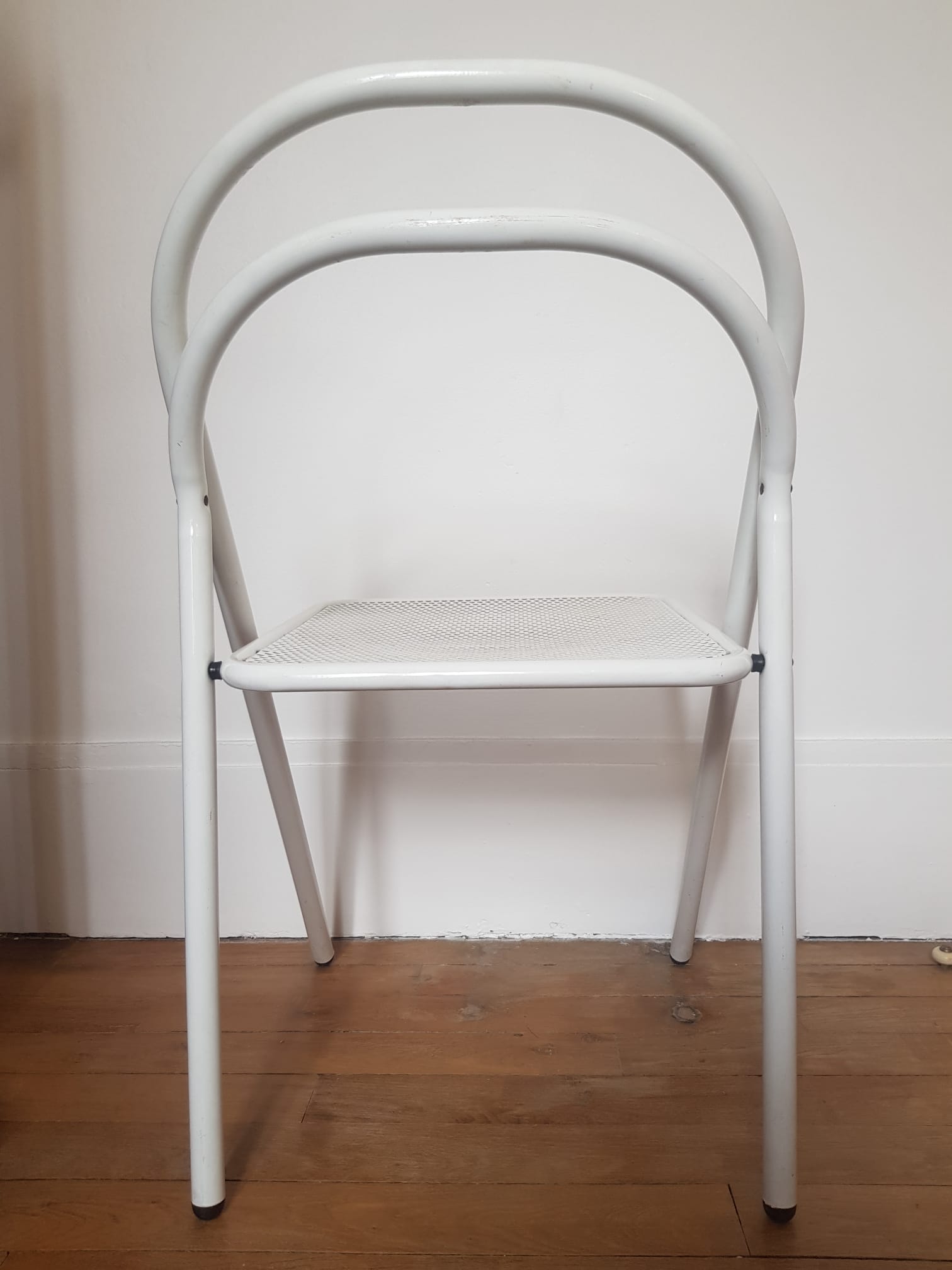 Vintage perforated metal folding chair