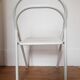 Vintage perforated metal folding chair