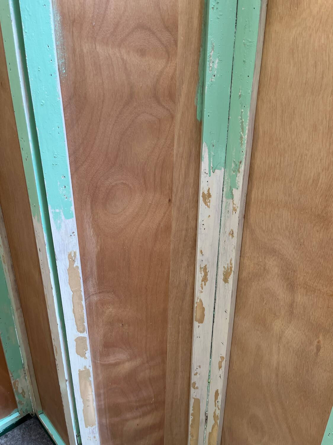 Wooden screen in Asian style, covered with Chinese wallpaper.
