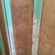 Wooden screen in Asian style, covered with Chinese wallpaper.