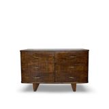 A vintage Italian chest of drawers, made of veneered walnut and solid wood,