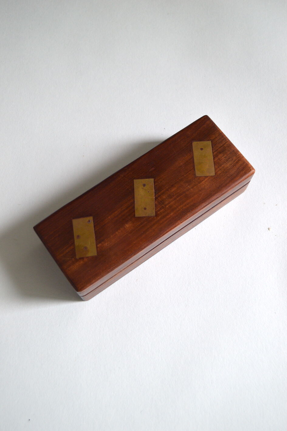 Box of brass and rosewood dominoes