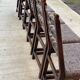 6 solid wood dining chairs with grey woven wool seats.
