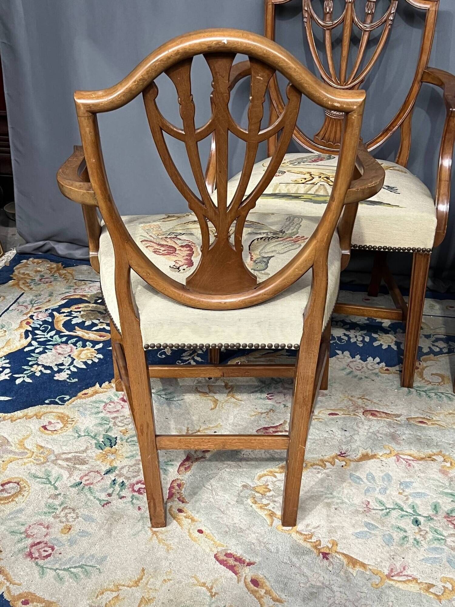 Set of four Sheraton-style armchairs. Solid walnut.