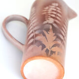 Vintage pitcher with plants in negative in pink / purple tones