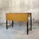 Vintage desk in modernist style made of wood.