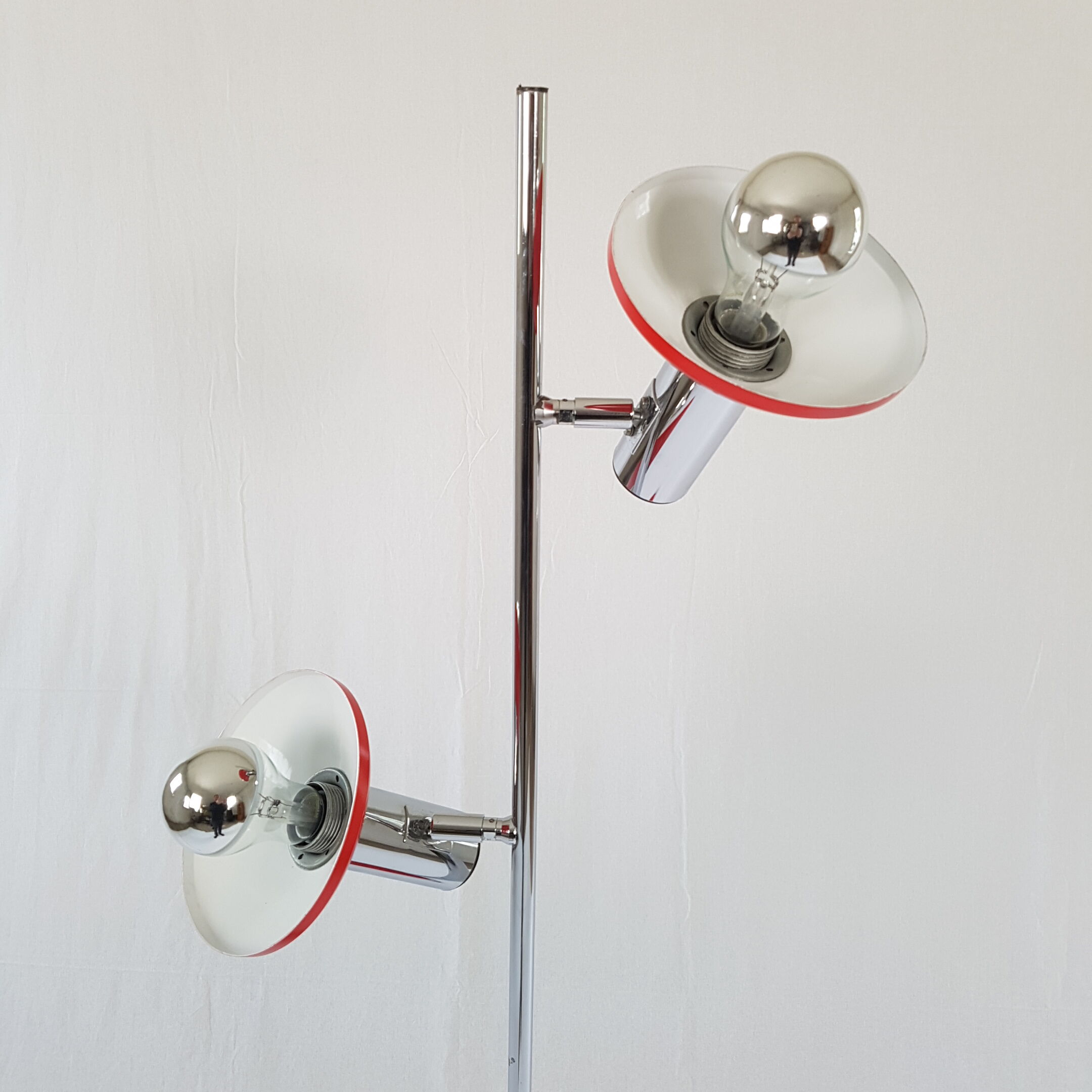 Two red lights and chrome floor lamp