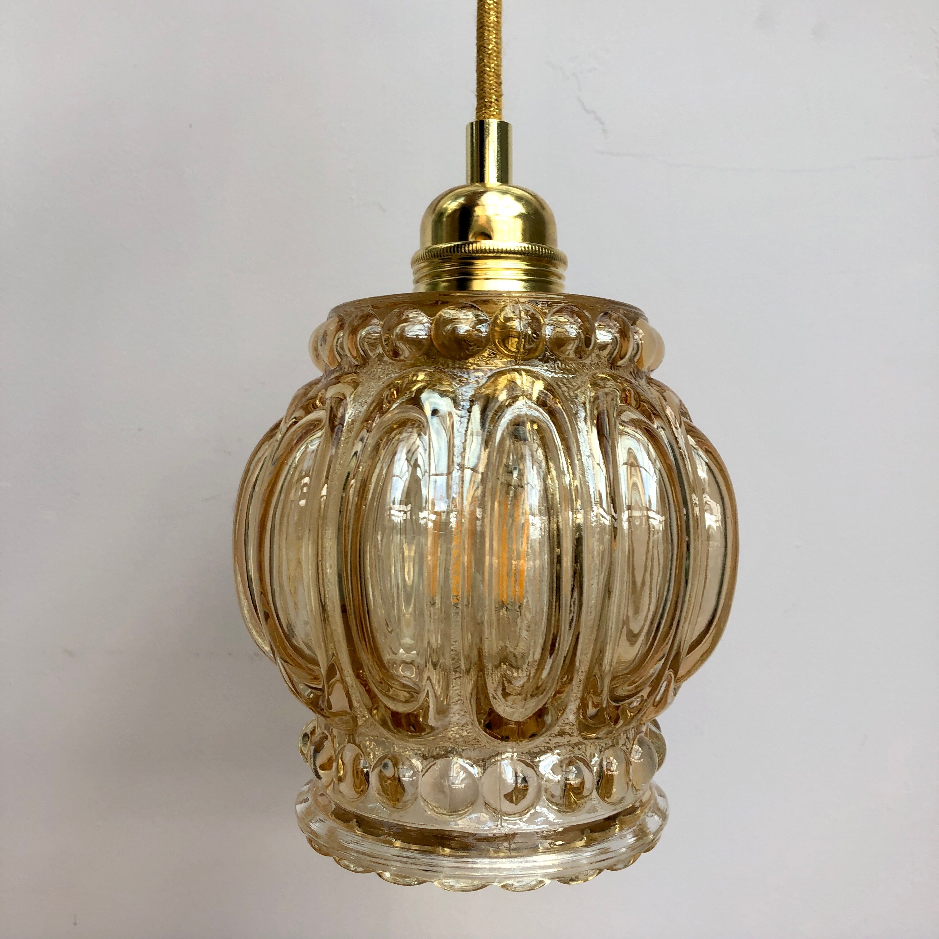 Vintage amber glass globe hand lamp