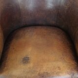 Sheep leather club chair finished with decorative nails