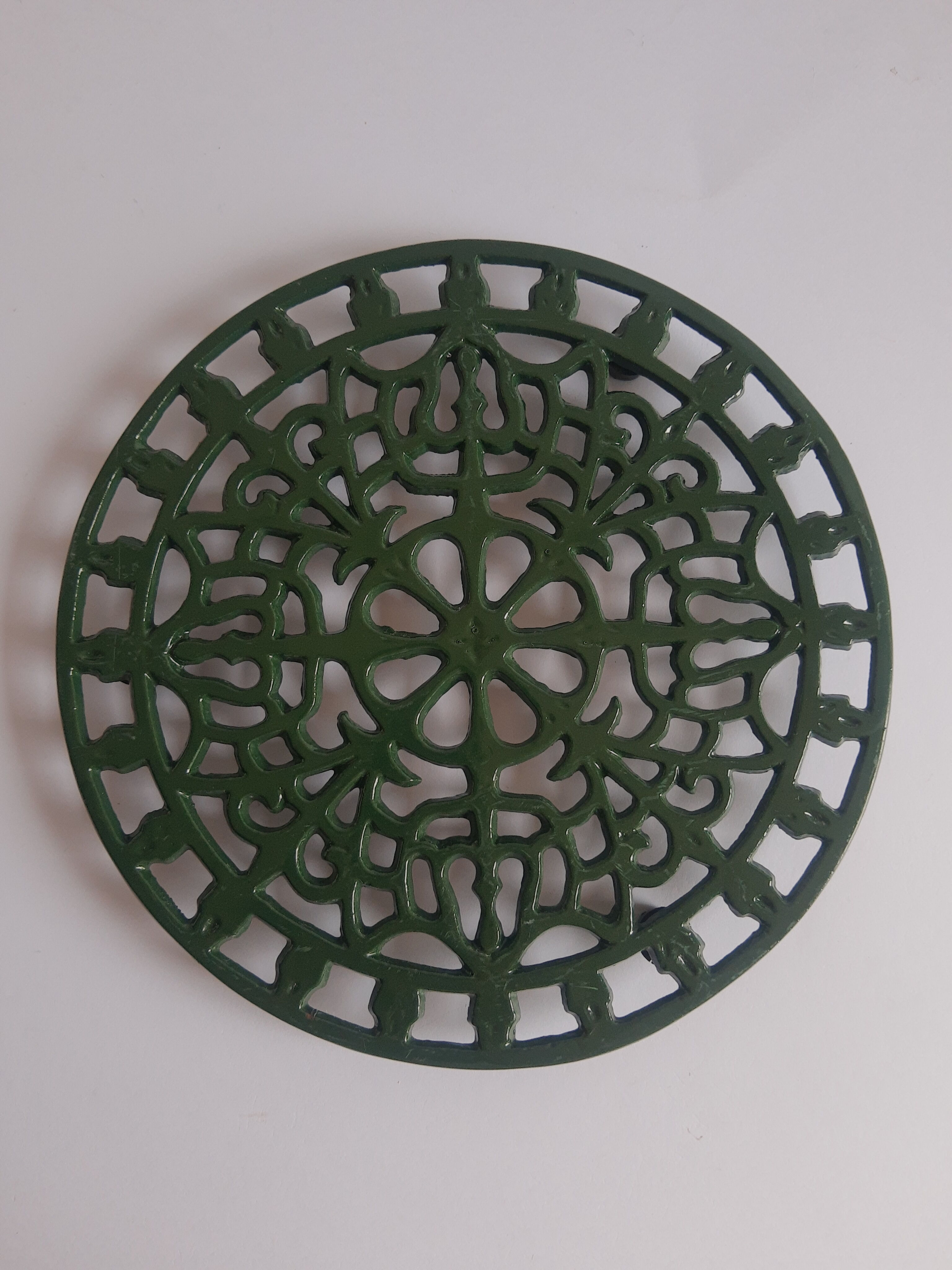 Vintage green cast iron trivet