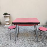 Table with two stools in red formica
