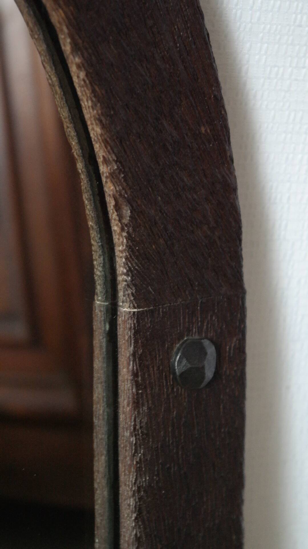 Old handcrafted Gothic style wooden mirror