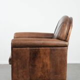 Vintage sheepskin armchair with warm colours and a characterful appearance