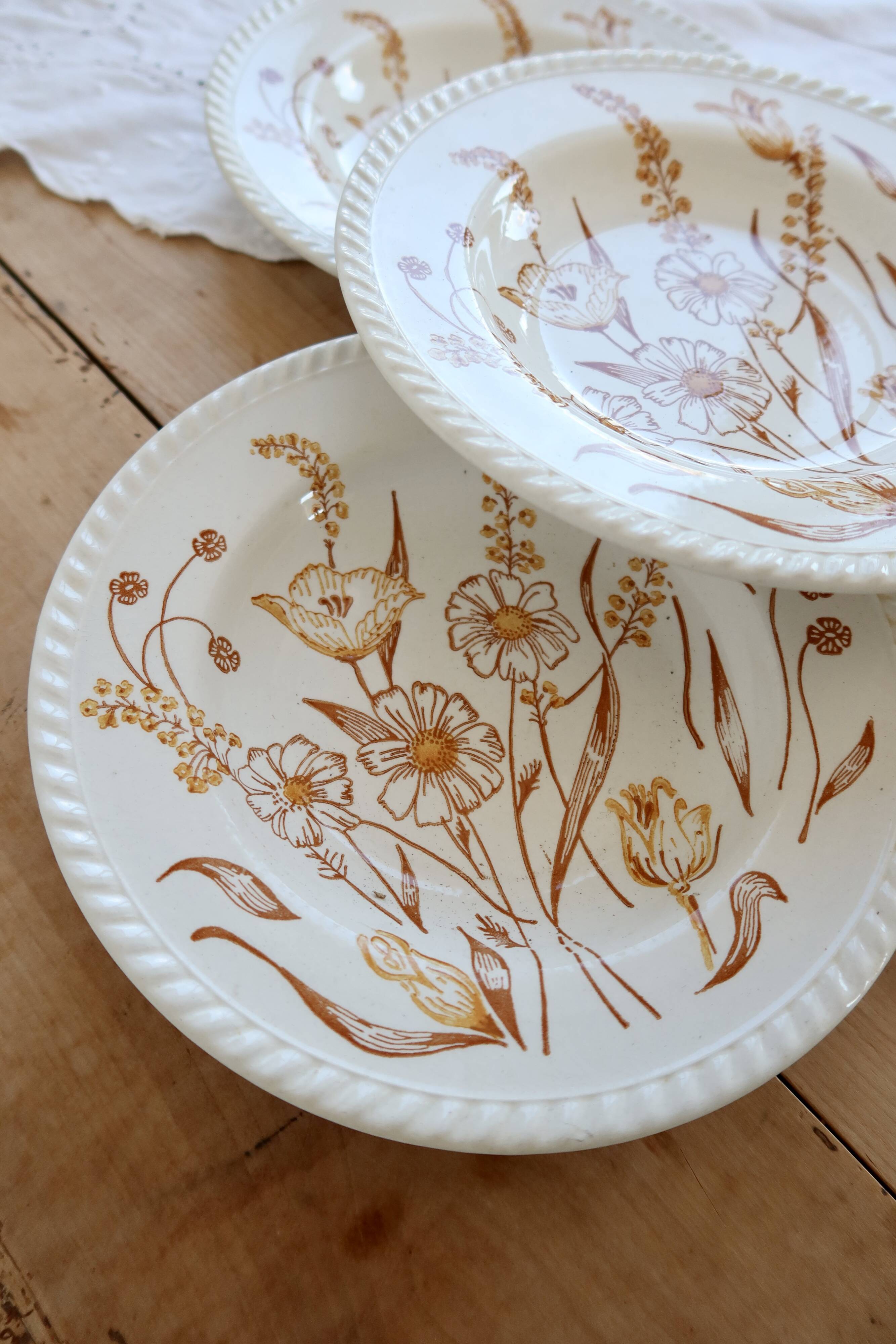 4 vintage deep plates with a brown floral design
