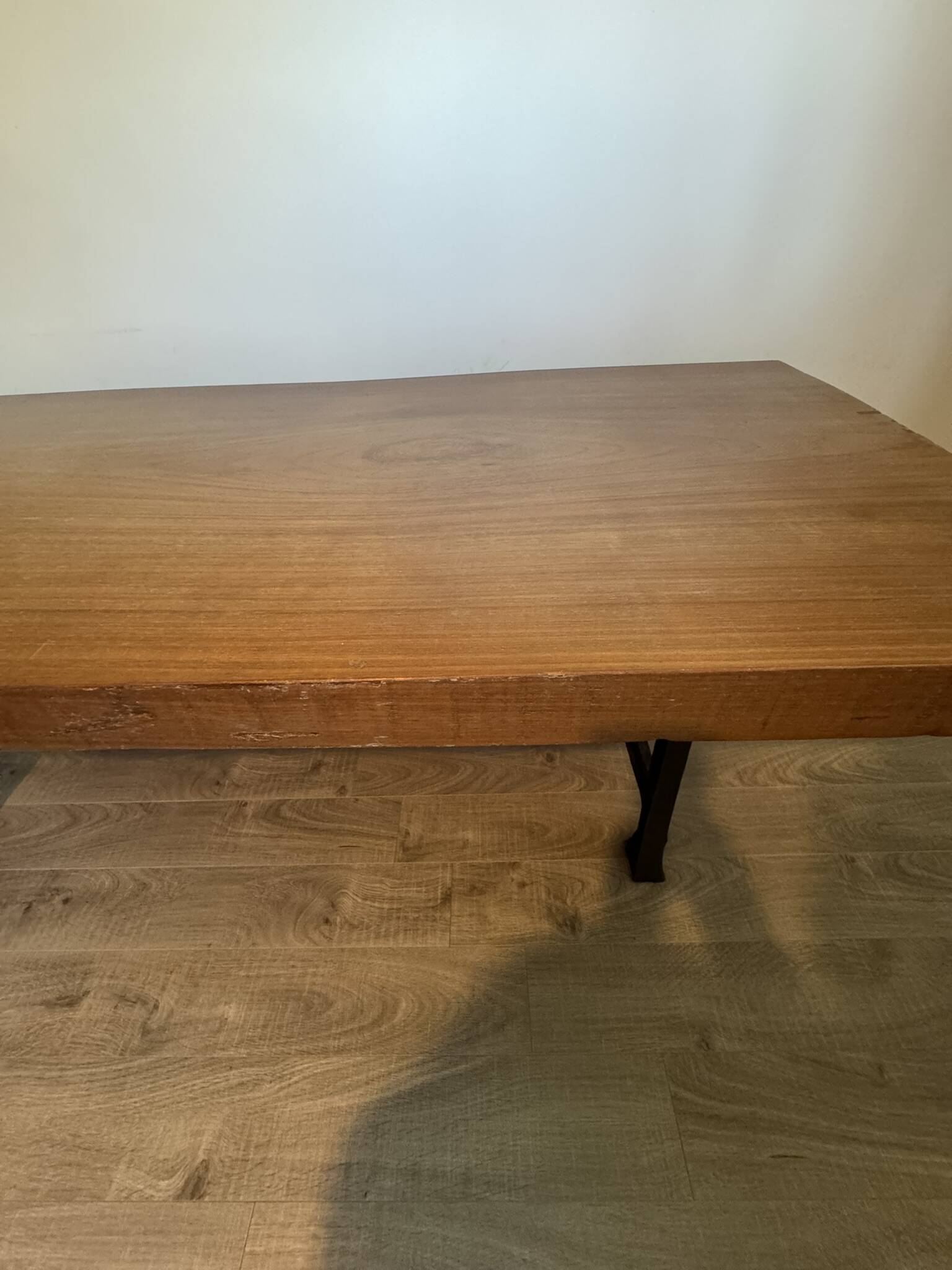 Industrial style table with a mahogany top.
