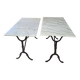 Pair of bistro tables in marble and cast iron.