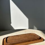 Trio of rounded rectangular trays or cups in monoxyl teak L:35