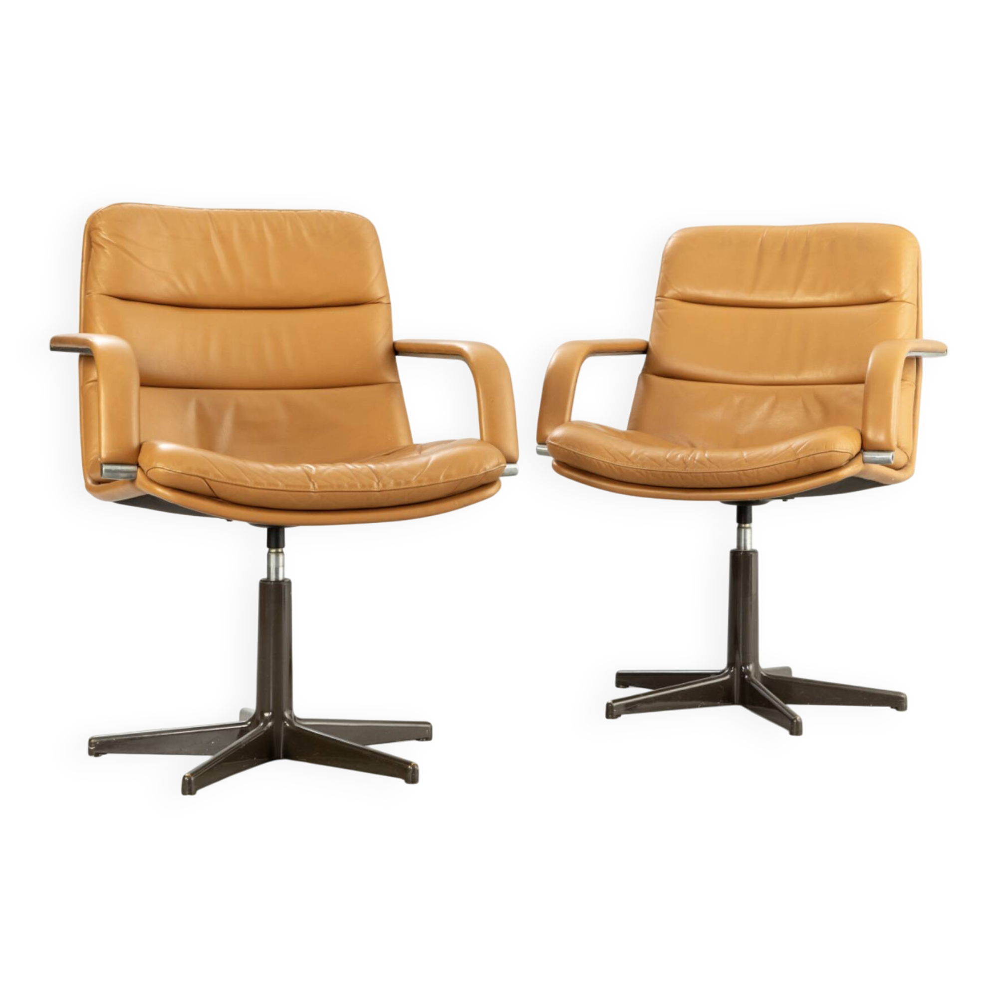 Pair of swivel armchairs by Geoffrey Harcourt.