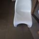 10 white chairs in the style of Verner Panton