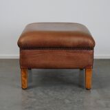 English-style leather ottoman in cognac-colored leather