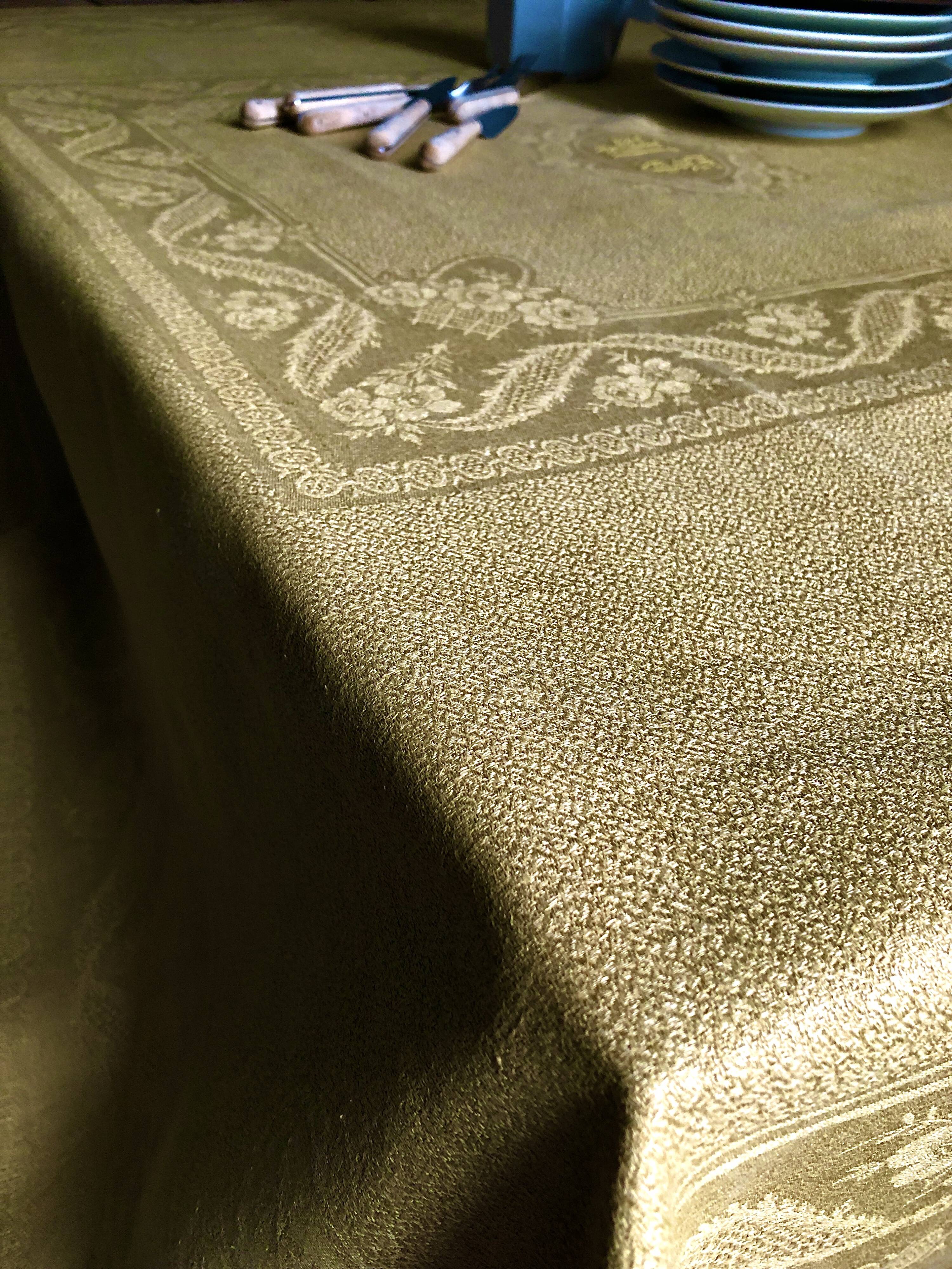 Old linen tablecloth and evening tinted in vermeil