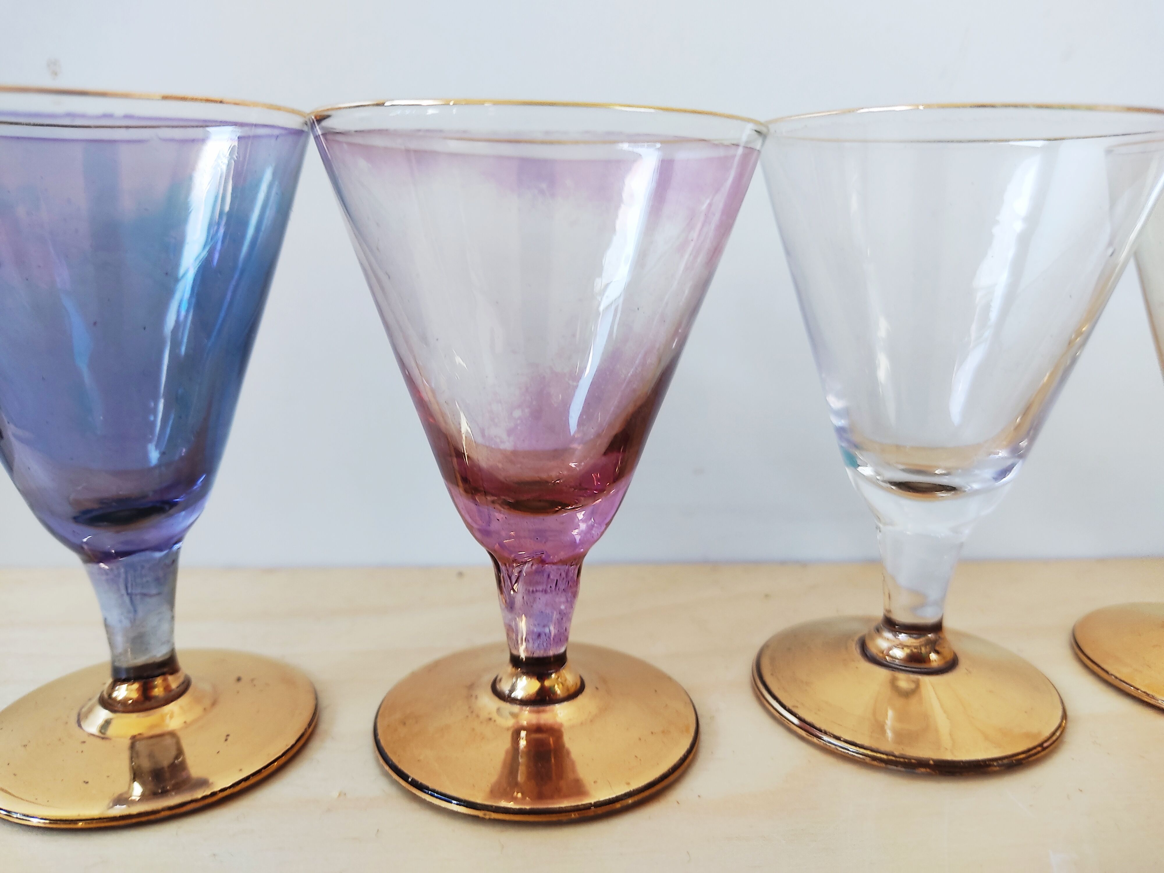 Series of 5 small glasses with golden foot