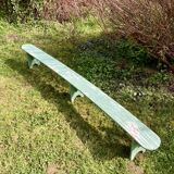 Old curved wooden farm bench