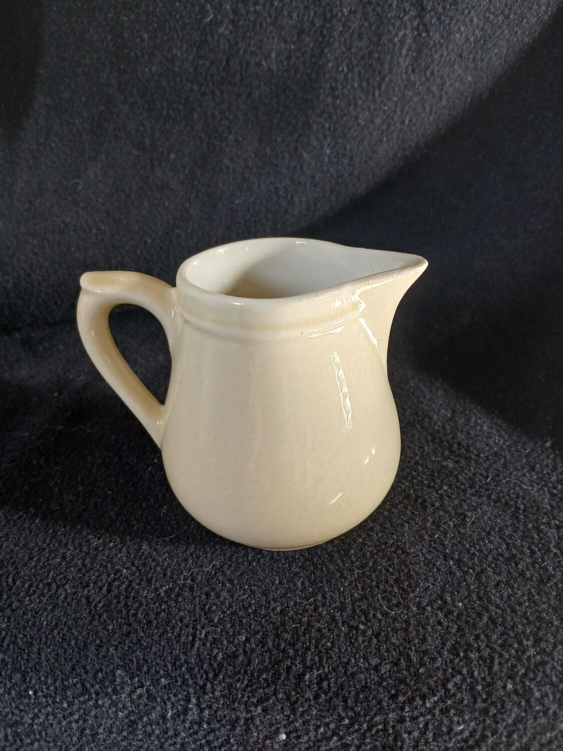 Old milk jug in steel clay
