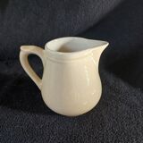 Old milk jug in steel clay