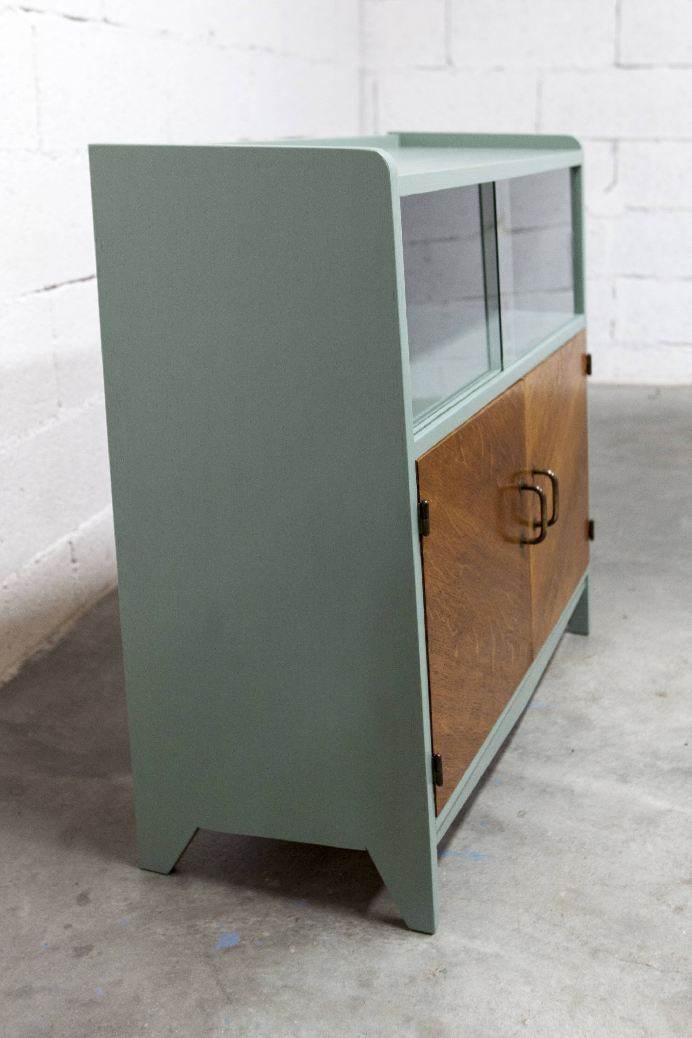 Atypical green noble 1960s low display cabinet.