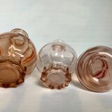 Trio of pink bottle decanters