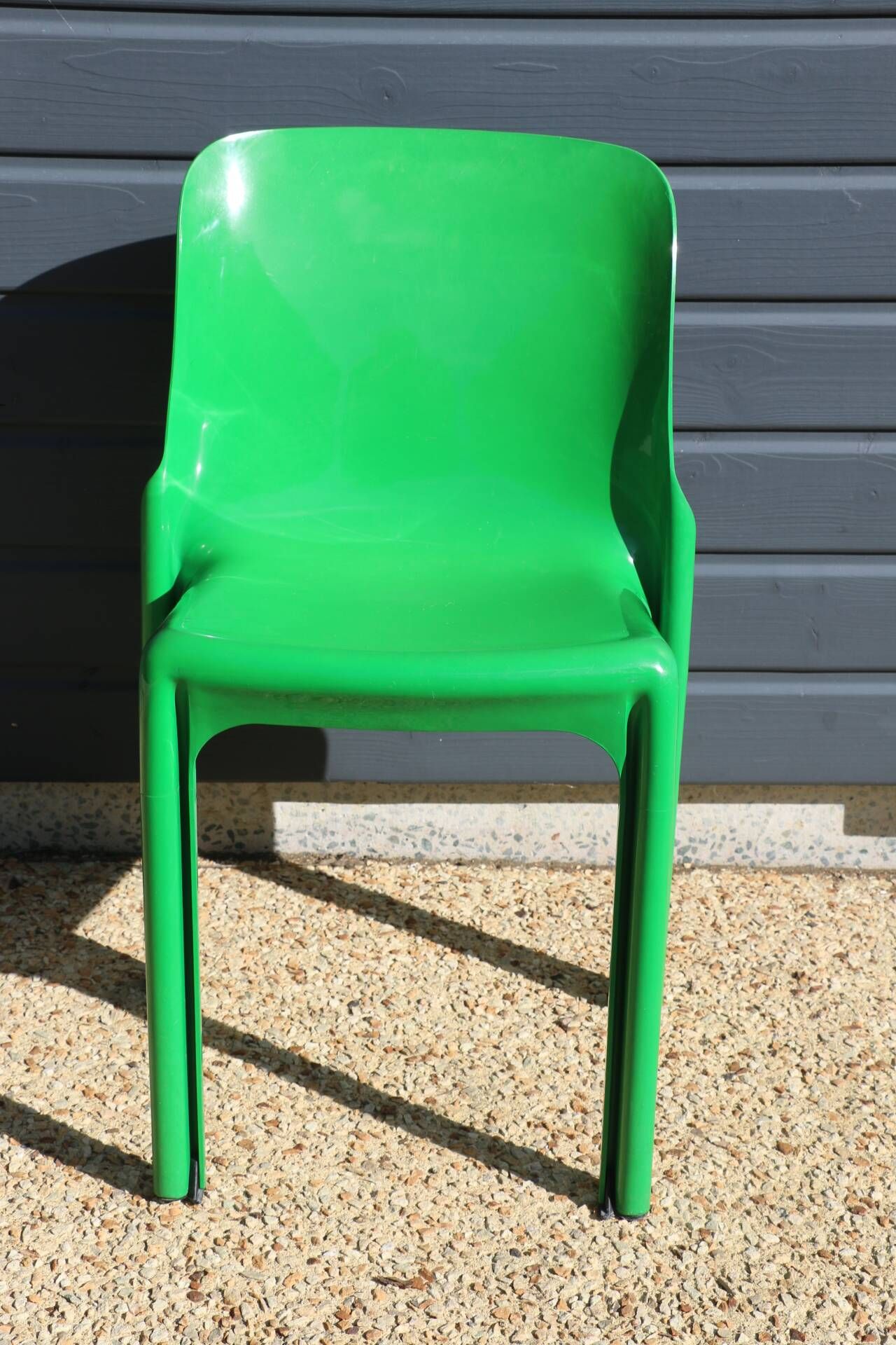 Set of 4 green Selene Magistretti chairs.