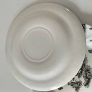 Set of black and white plates in the style of toile de Jouy.