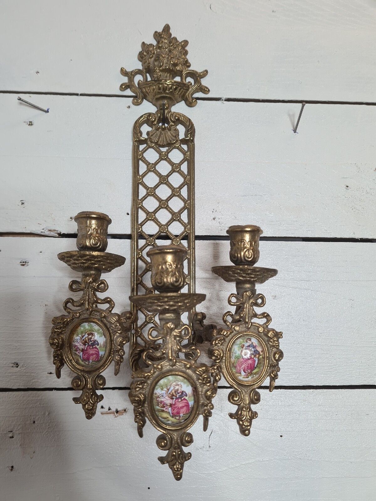 Bronze wall candle holder