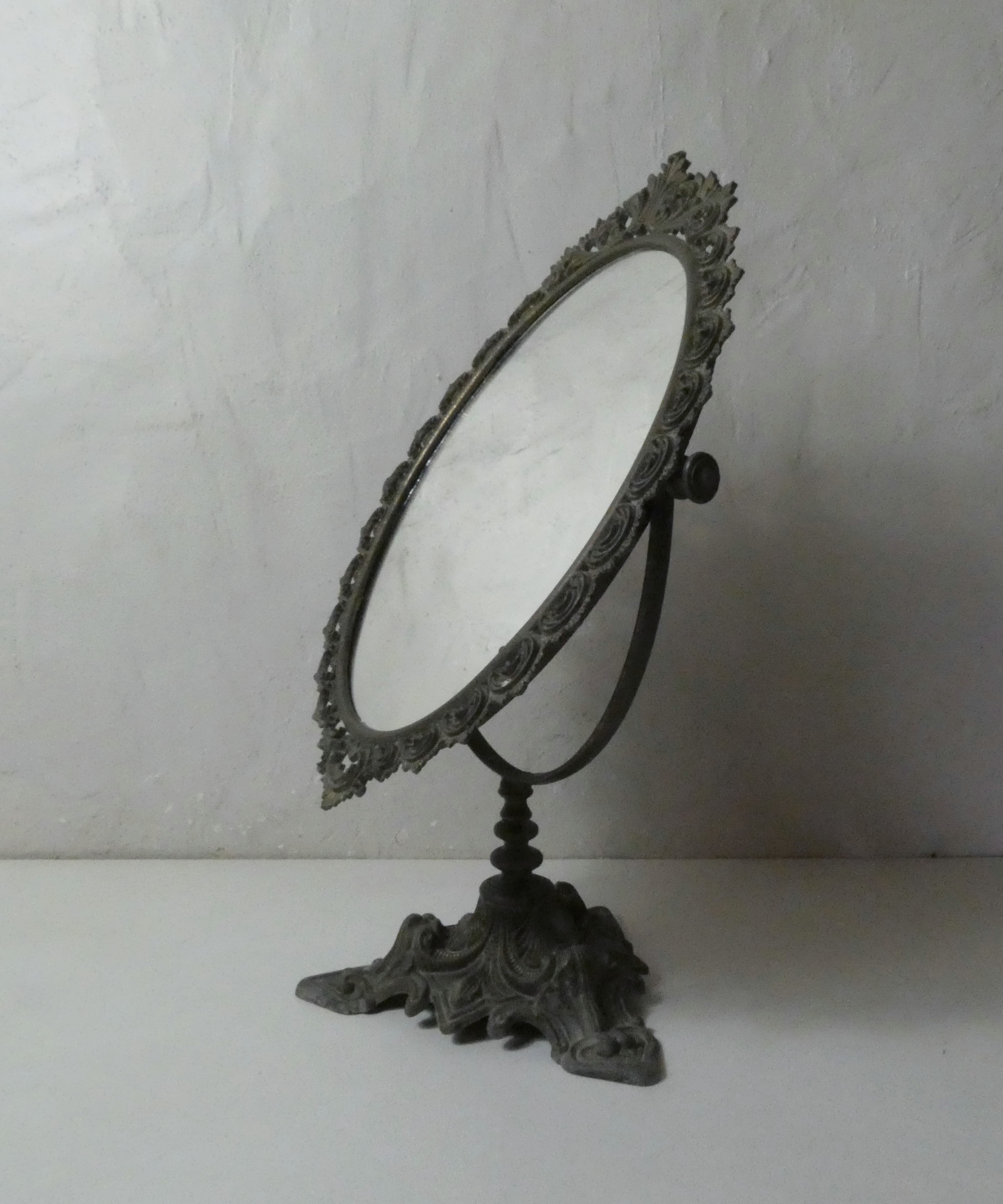 Old psyche mirror in bronze 50cm