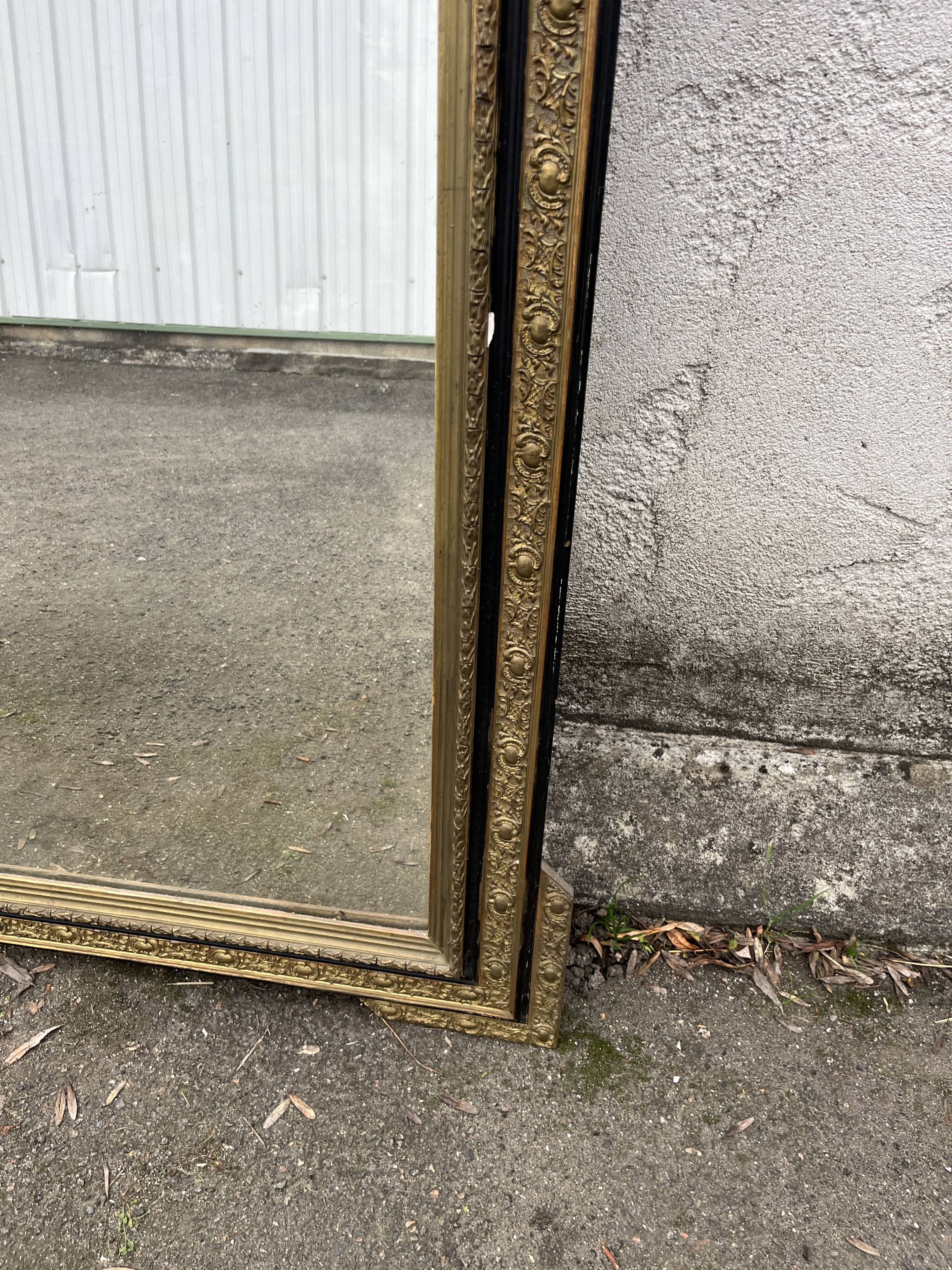 Large antique gilt mirror with scroll and shell decoration, 144 cm