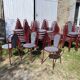 Metallic burgundy bistro chair for restaurants and communities with gray fabric