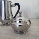 Rémy Letang / Teapot, milk jug and sugar bowl in 18/10 stainless steel and Bakelite