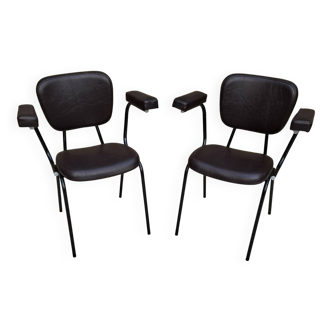 Brown faux leather armchairs