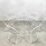 Plia' chairs by Giancarlo Piretti for Castelli with a table