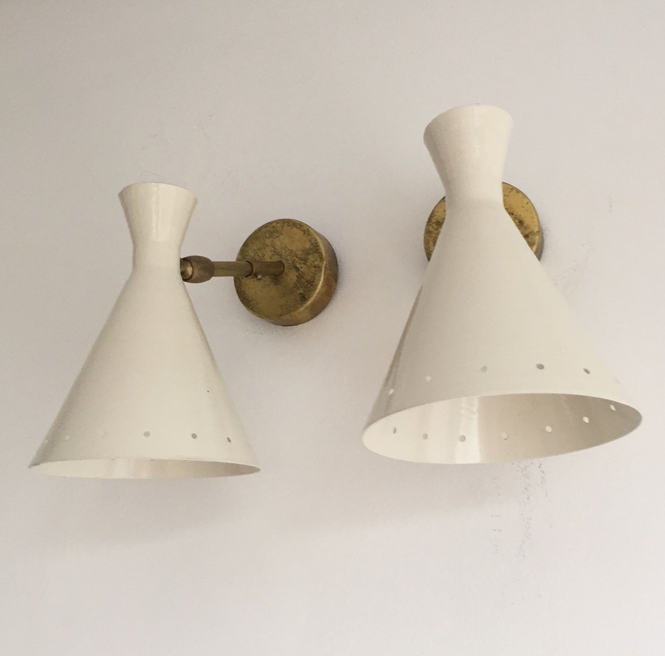 Pair of white and brass sconces