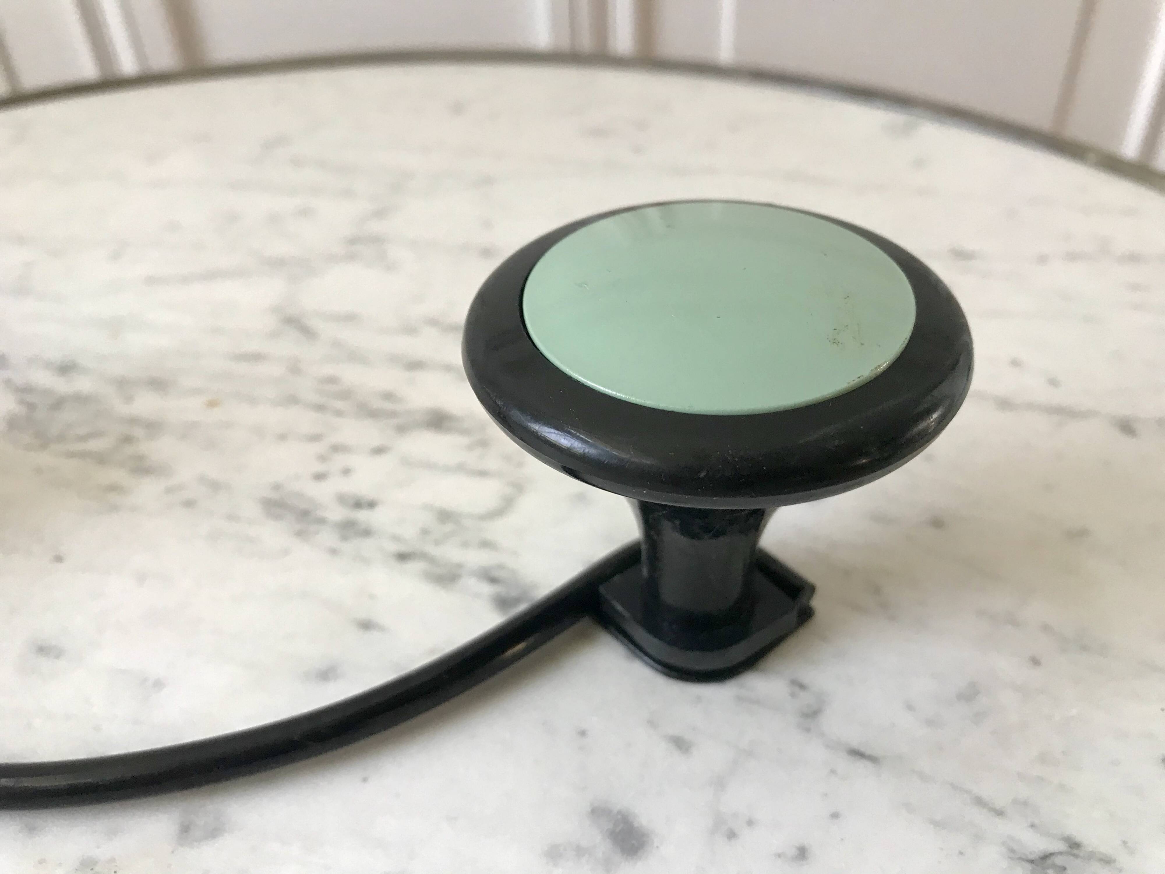 Design coat hook in sage green and black metal from the 70s