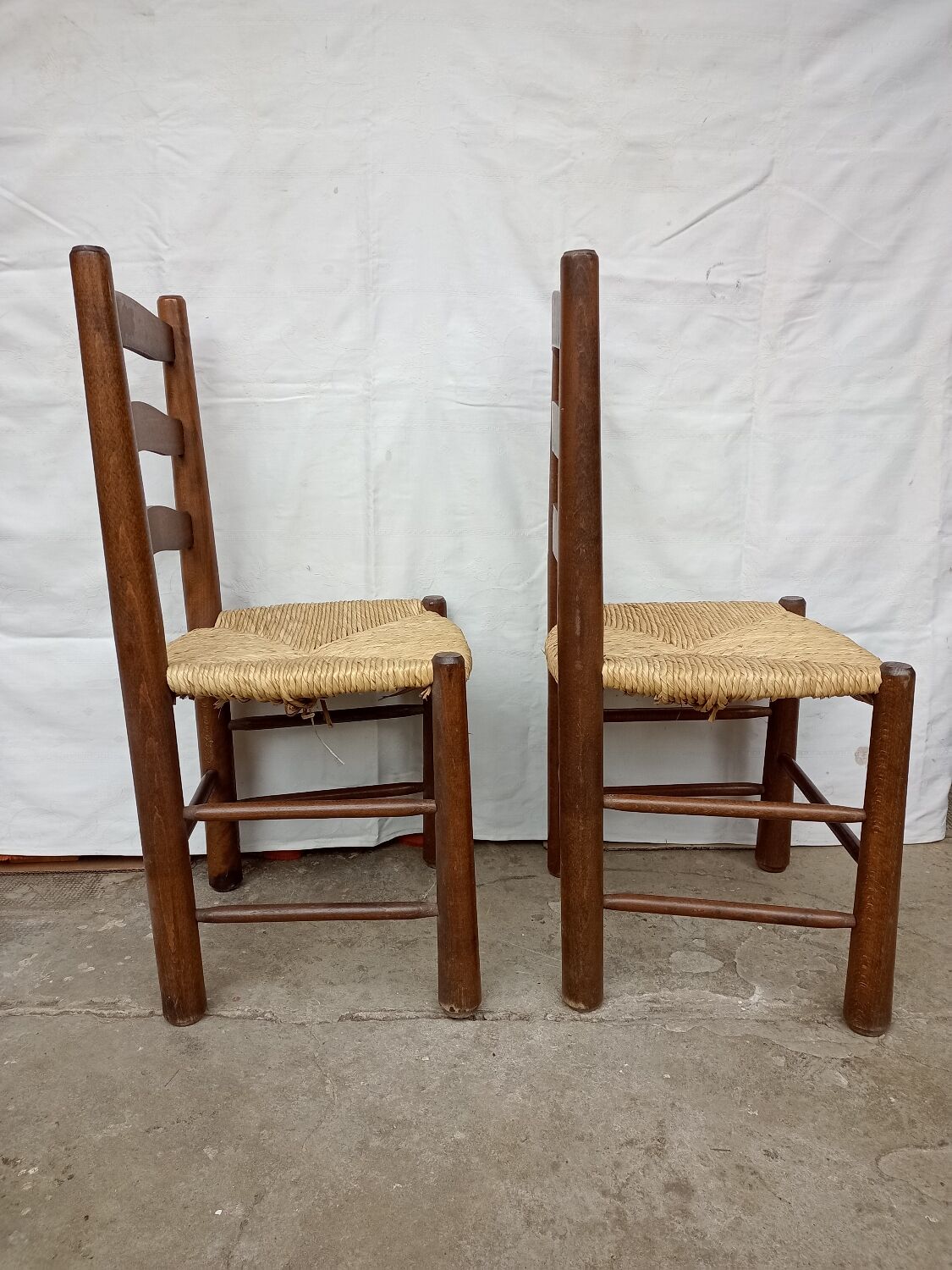 Brutalist chairs in walnut and straw