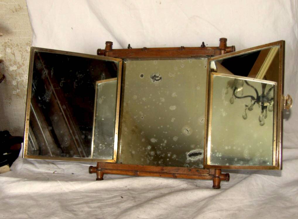 Beveled mercury mirror and japanese art nouveau illustration on the back
