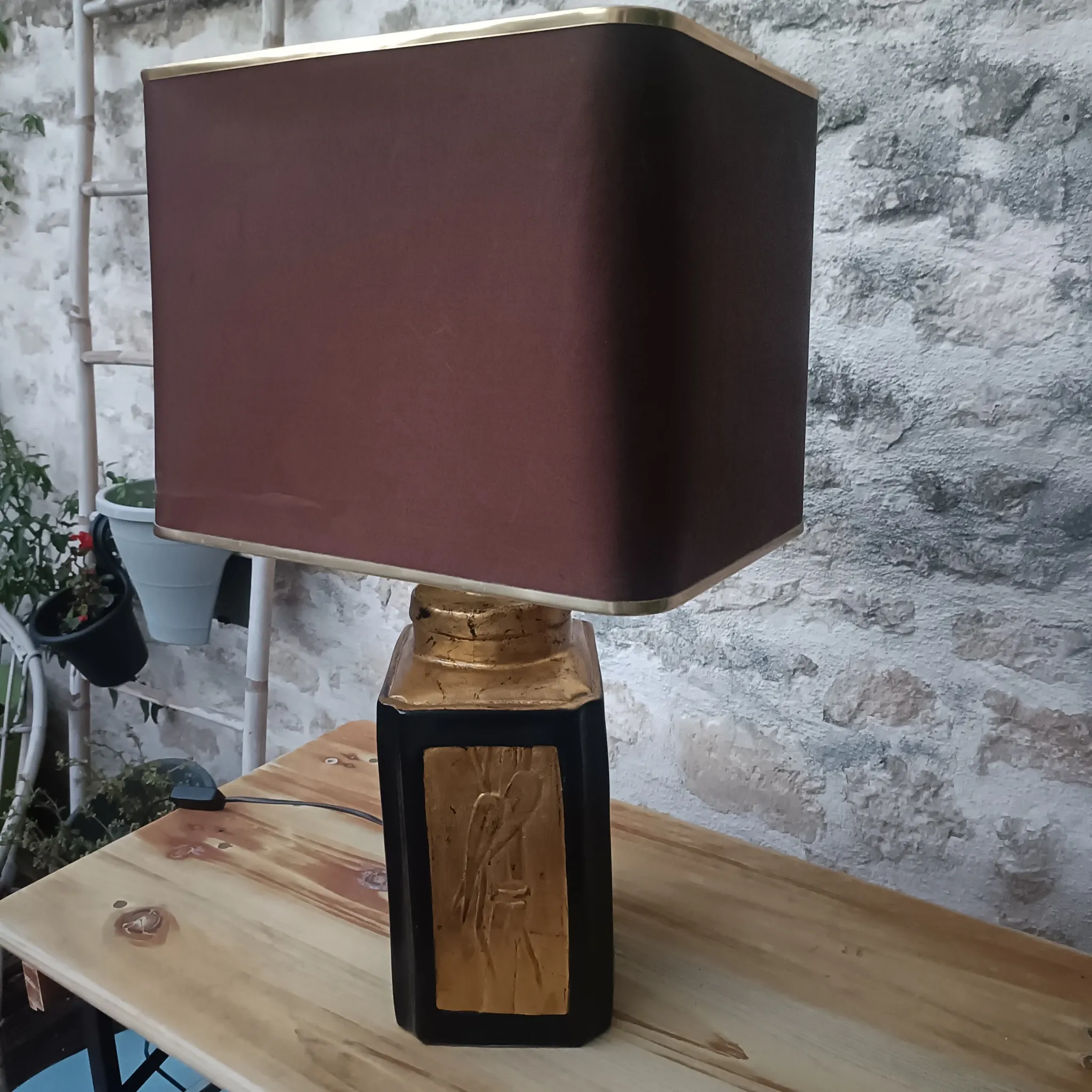 Large ceramic lamp with an Asian theme.